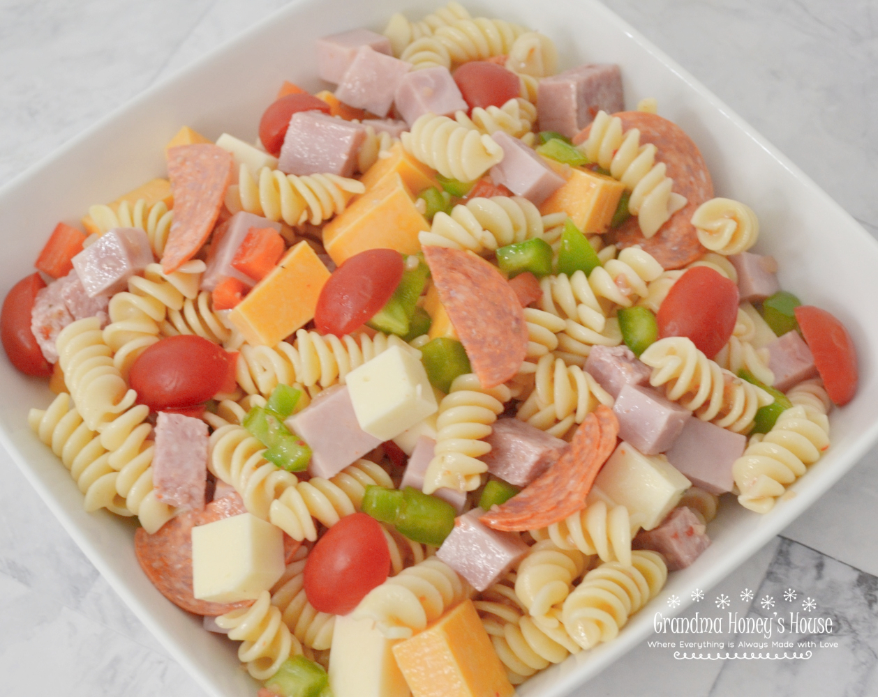 This Protein Packed Pasta Salad is loaded with veggies, meats, and cheeses. Colorful, delicious, and perfect to transport to any summer event. This scaled down version is perfect for 2 or 3 people.