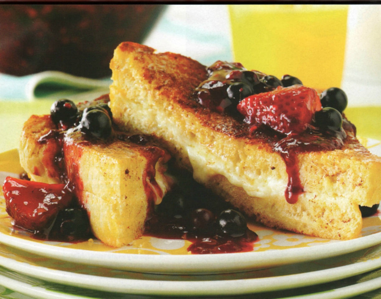 French toast stuffed with mascarpone cheese filling and topped with fresh berry sauce.