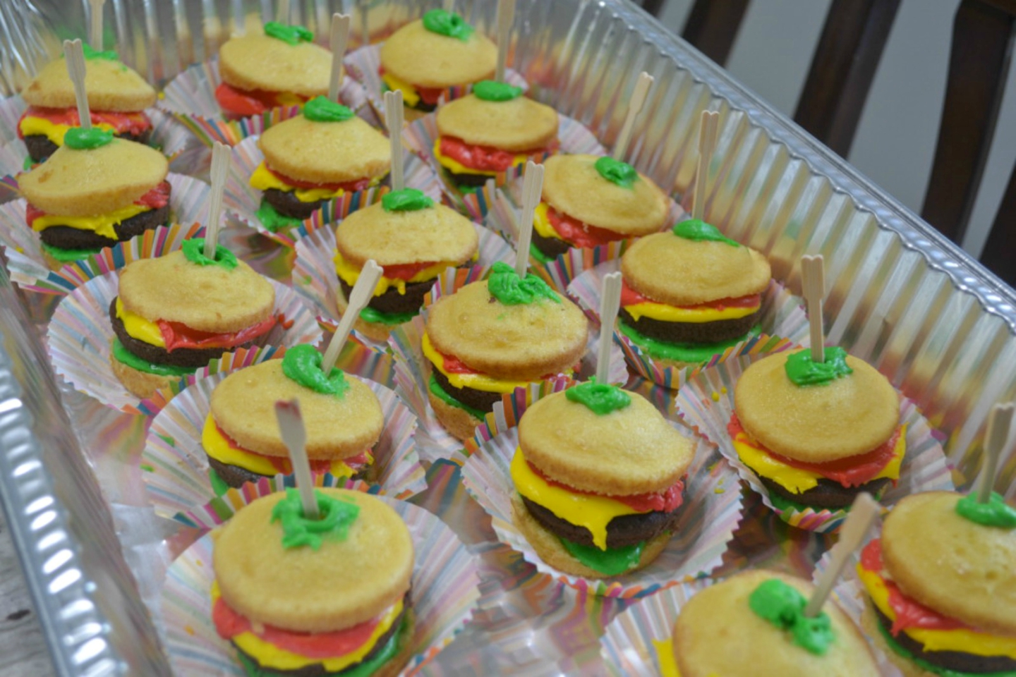 Cook-out Cupcakes are a fun and tasty summertime dessert. Cupcakes are decorated to look like a cheeseburger. Loved by adults as well as children.