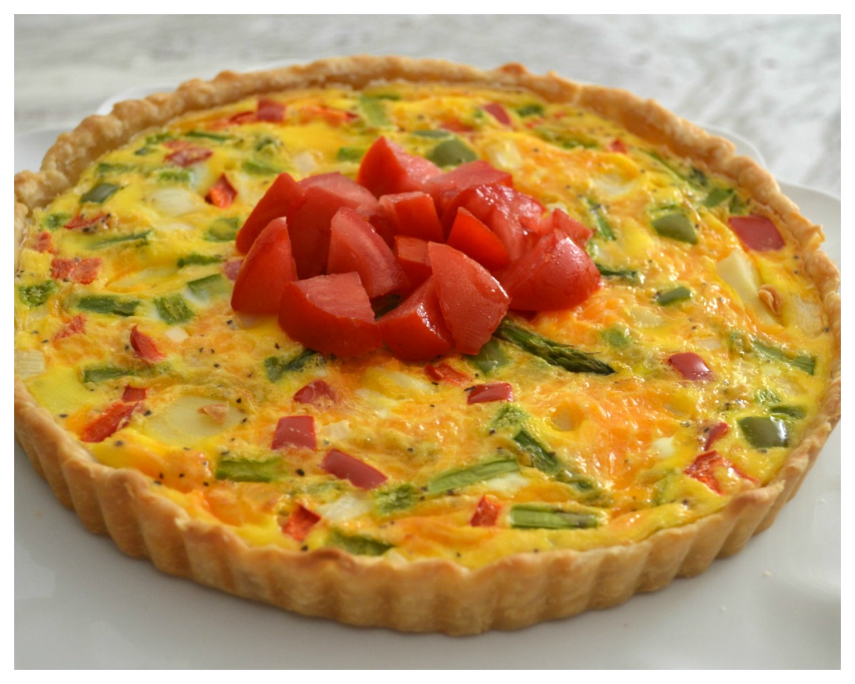 A delicious brunch tart filled with fresh veggies, eggs and cheese. Perfect way to use those summer vegetables.