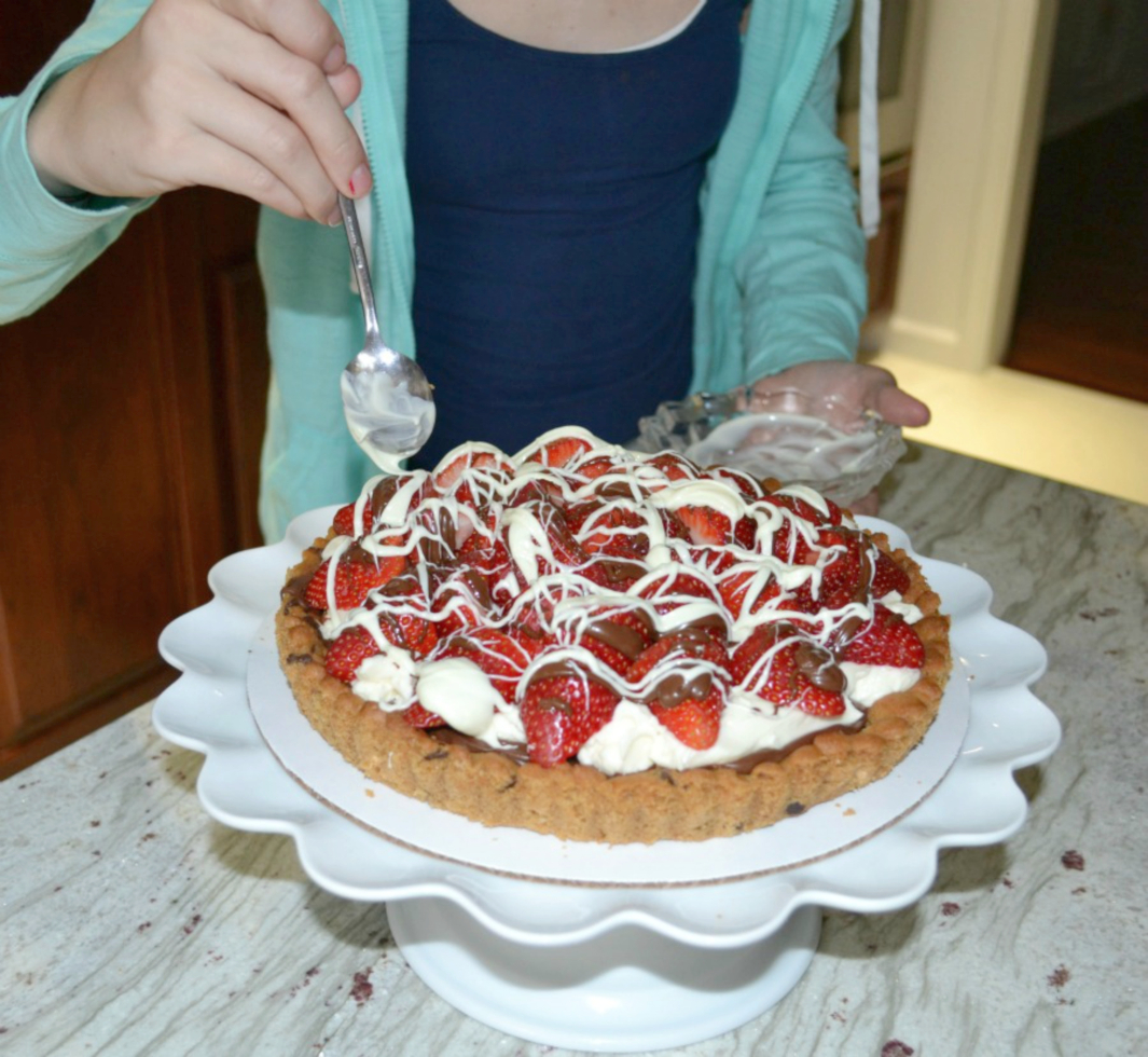 Strawberry Mascarpone Hazelnut Chocolate Tart is an easy yet elegant dessert made with a refrigerated chocolate chip cookie crust, creamy mascarpone filling, chocolate hazelnut spread, and fresh strawberries on top.