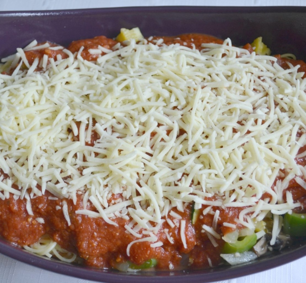 Cheesy Garden Patch Spaghetti bake is loaded with veggies, sauce, pasta and cheese. 
