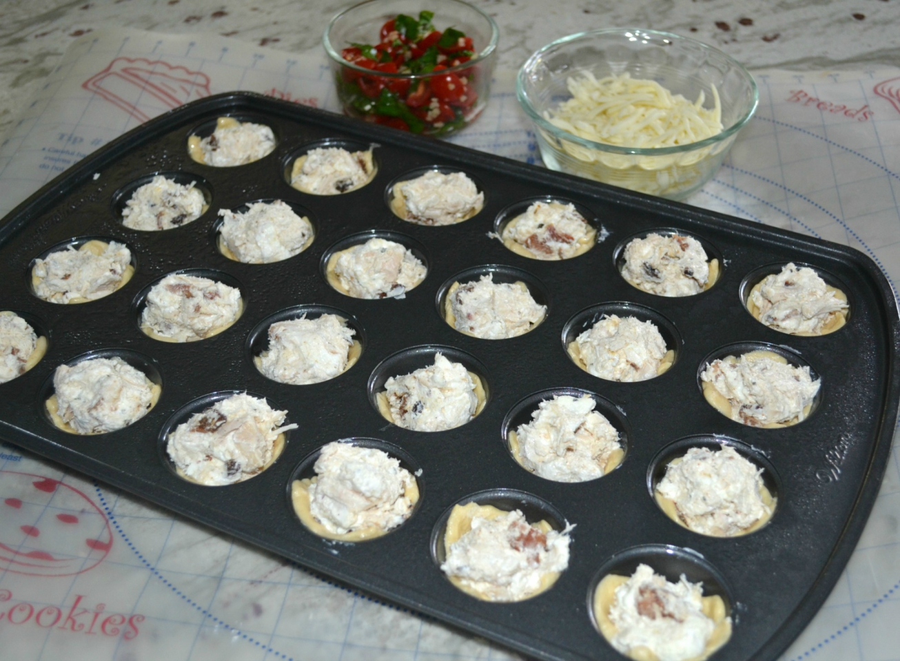 Chicken-Bacon-Caprese Bites are perfect to add to your tailgate menu. Chicken, cheese and a caprese topping baked in a crescent dough cup