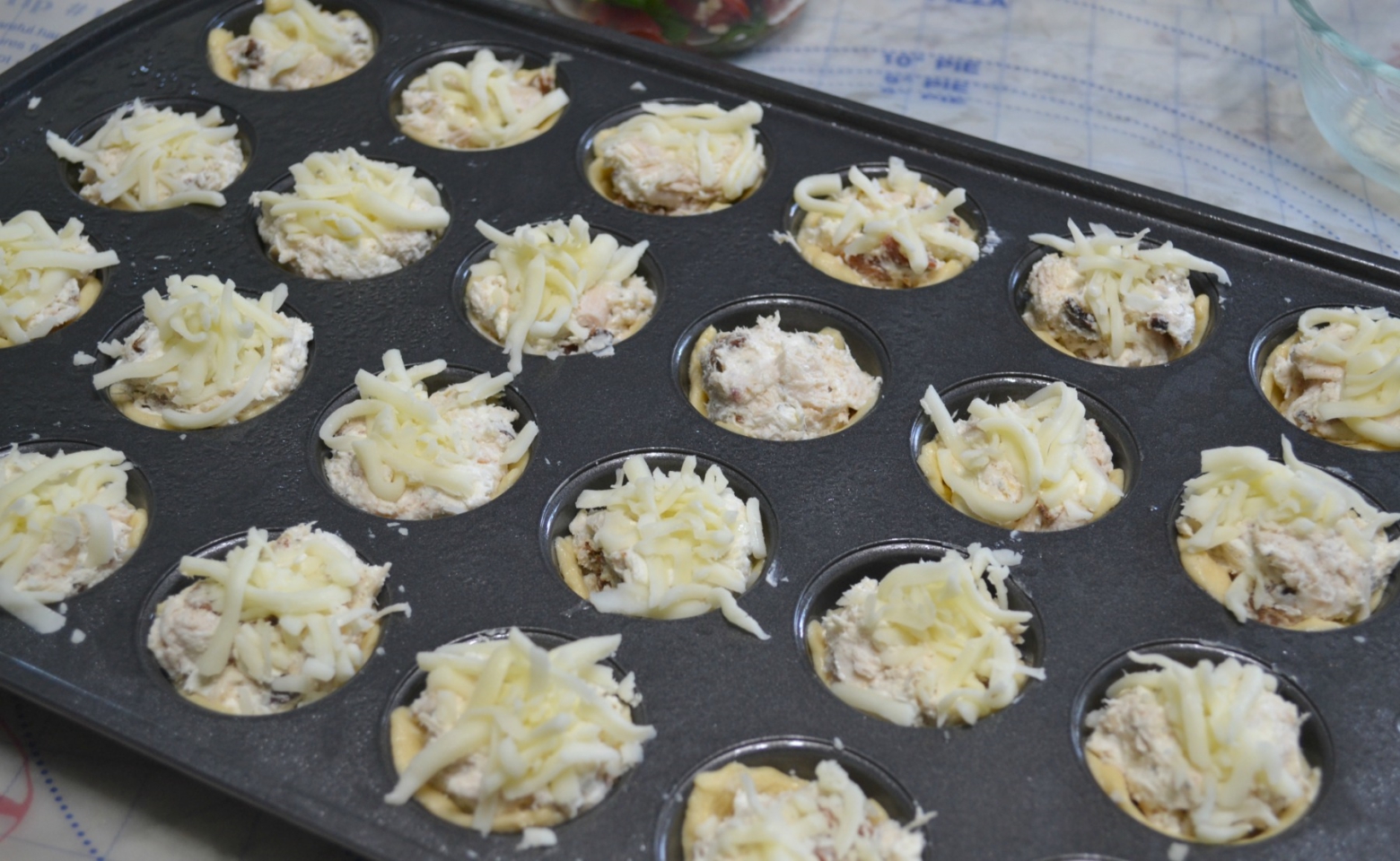 Chicken-Bacon-Caprese Bites are perfect to add to your tailgate menu. Chicken, cheese and a caprese topping baked in a crescent dough cup