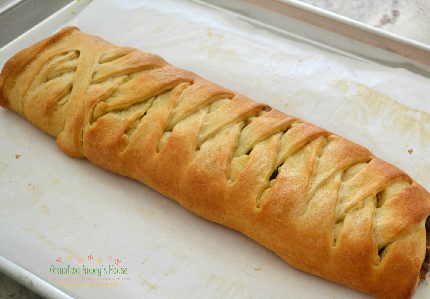 A beautiful breakfast braid filled with pumpkin, nuts, and mascarpone cheese. Baked in a refrigerated crescent dough.