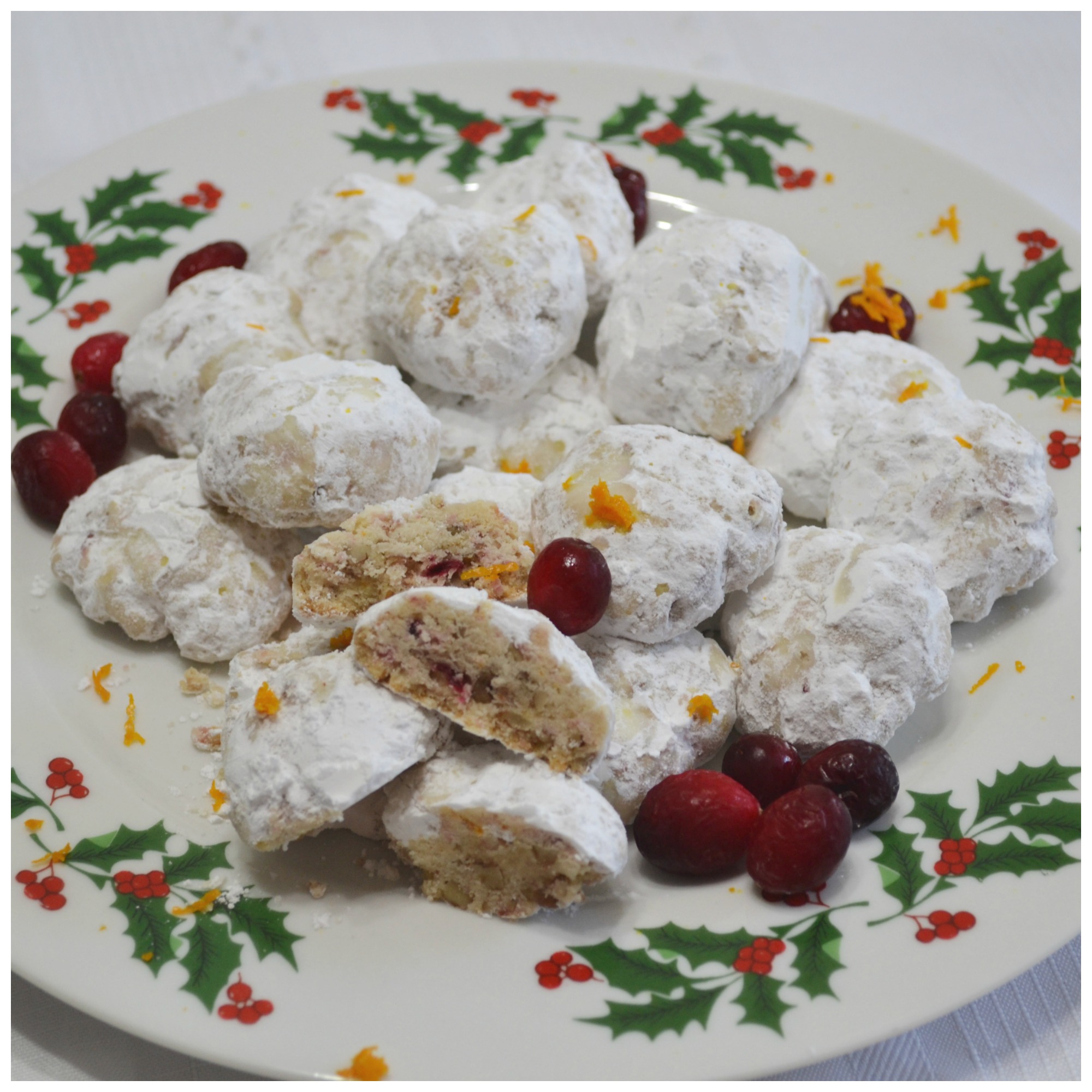 A delicious holiday cookie starting with a snowball recipe and upgraded with frozen cranberries and orange zest.