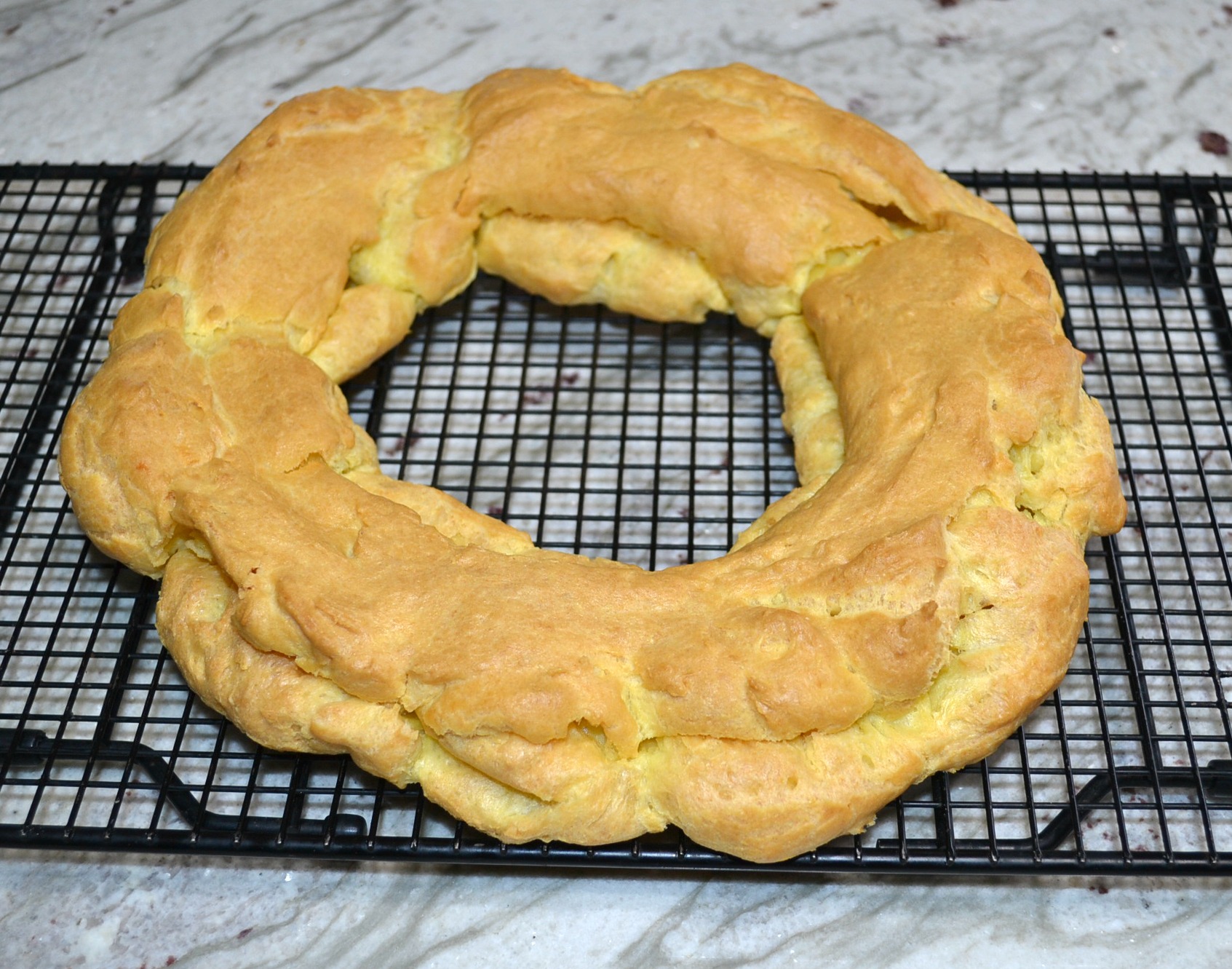 This elegant dessert is a cream puff ring filled with pudding and cherry pie filling.