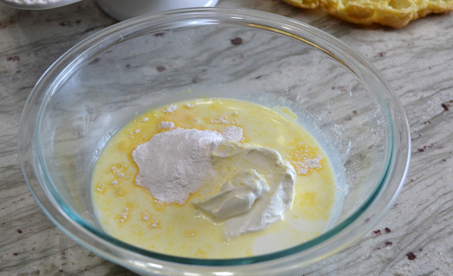 This elegant dessert is a cream puff ring filled with pudding and cherry pie filling. 