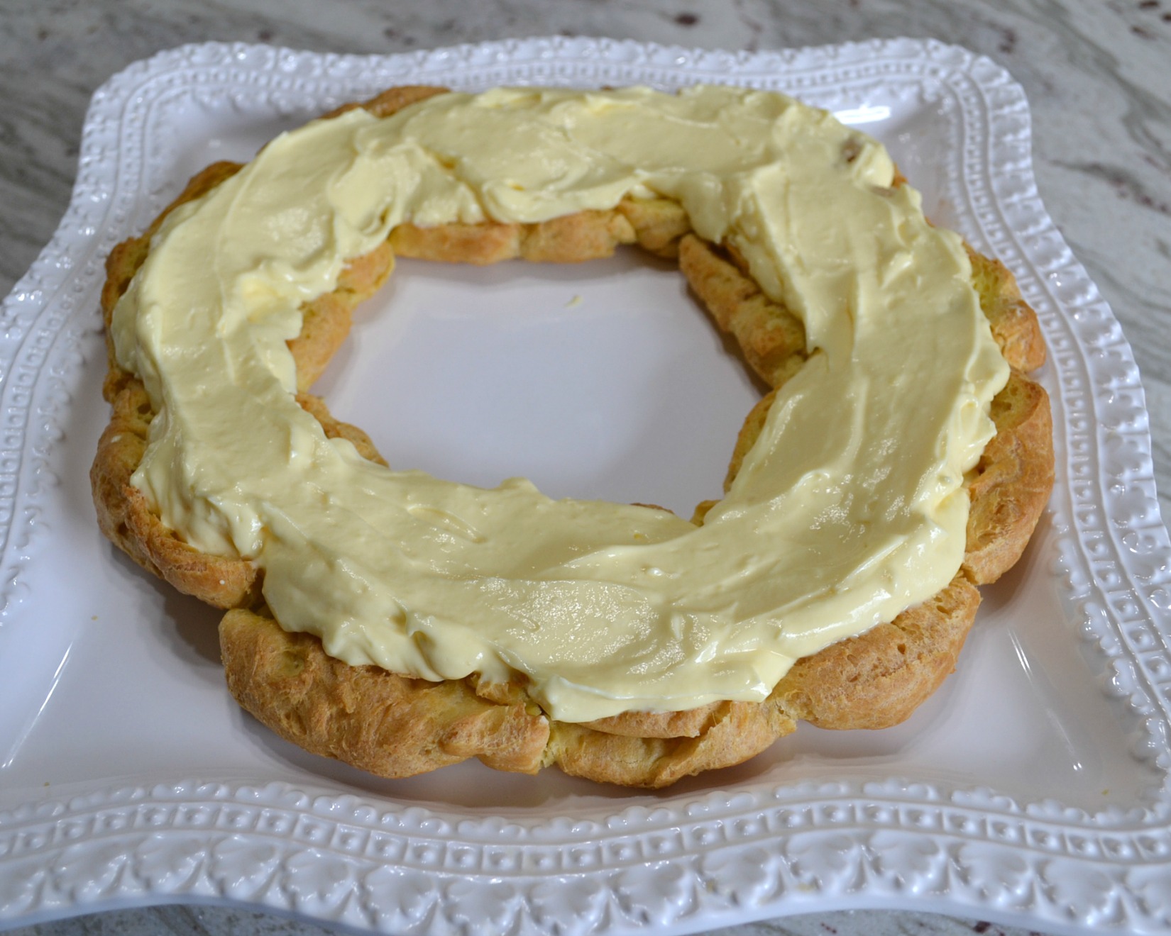 This elegant dessert is a cream puff ring filled with pudding and cherry pie filling. 