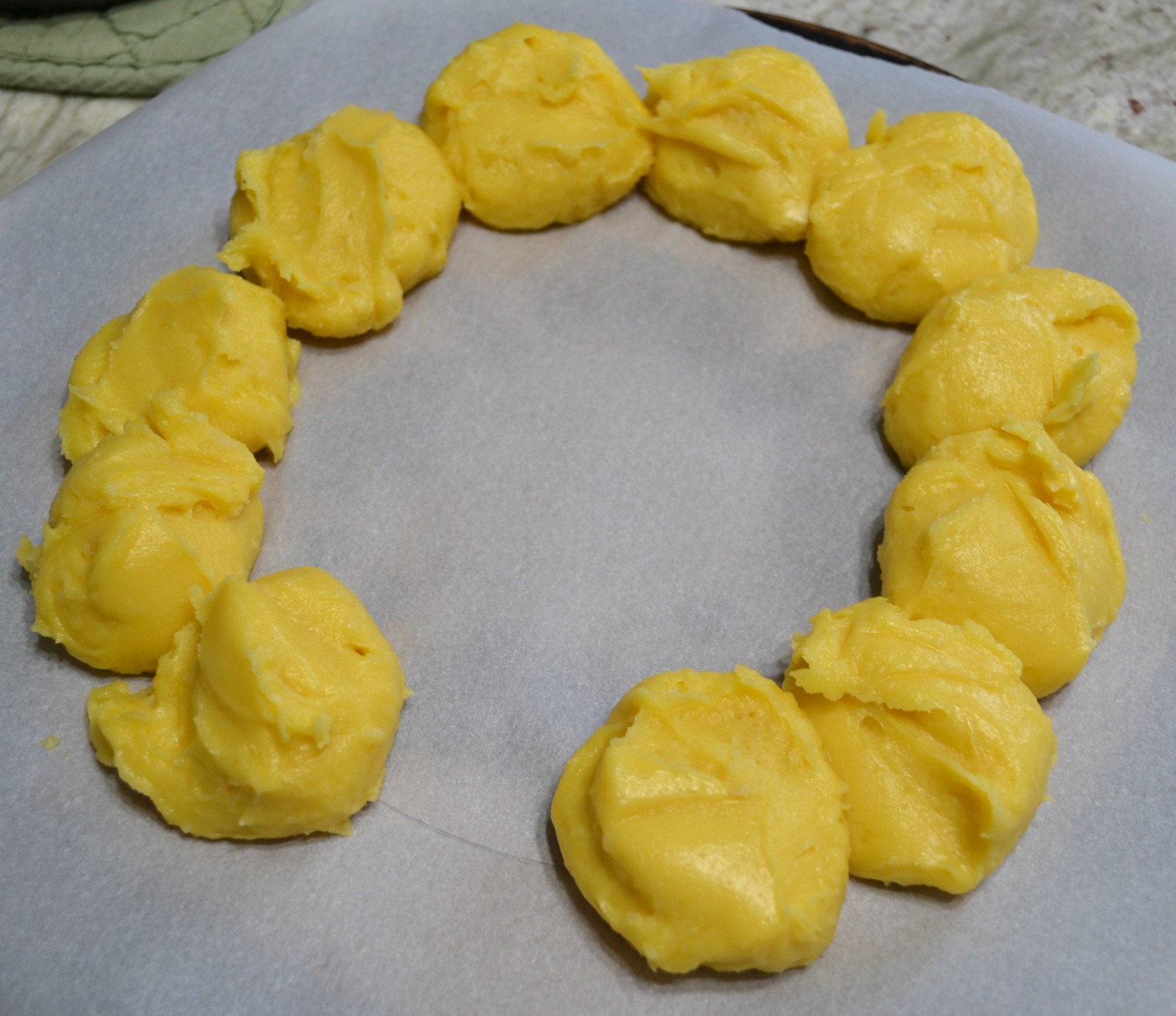 This elegant dessert is a cream puff ring filled with pudding and cherry pie filling. 