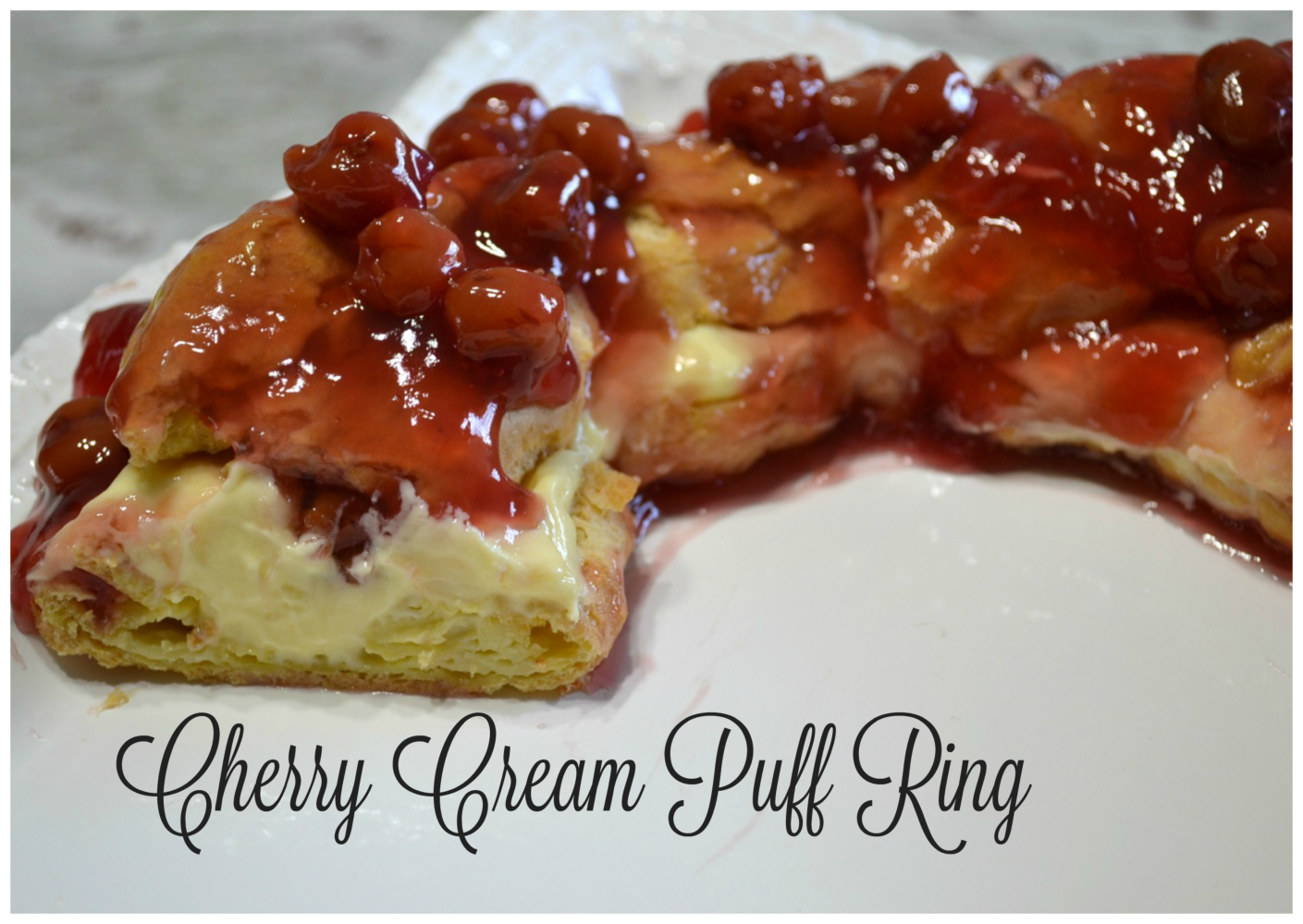 This elegant dessert is a cream puff ring filled with pudding and cherry pie filling.