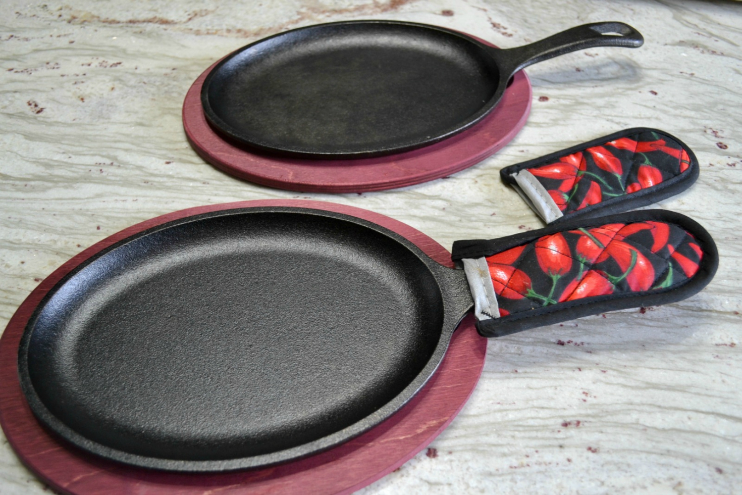 A healthy, colorful skillet dinner of fresh veggies, grilled turkey cutlets served on a cast iron skillet and drizzled with sweet chilli sauce.