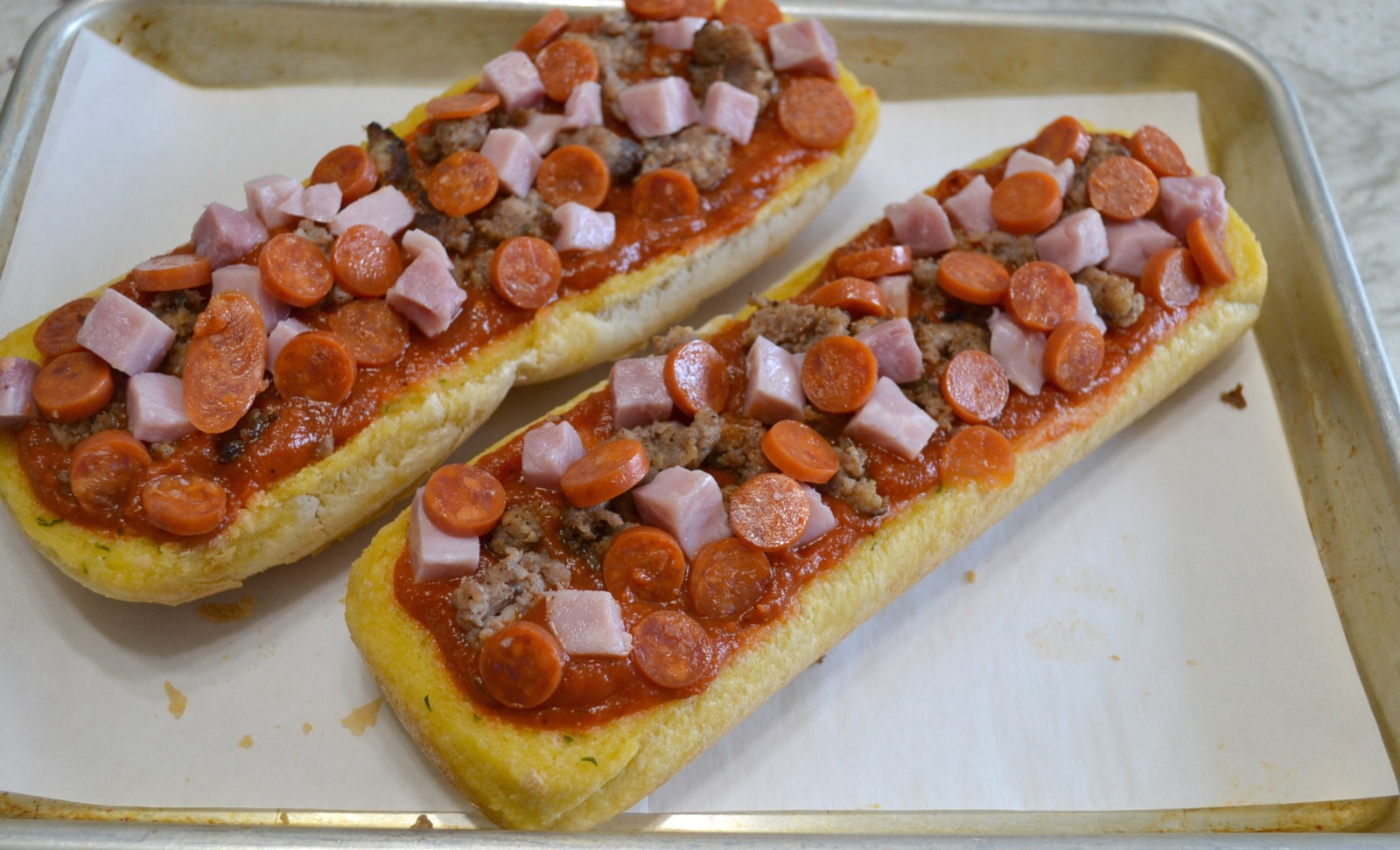 A quick and easy pizza made on a loaf of garlic bread. Add your favorite toppings and cheese for a great snack or lunch.