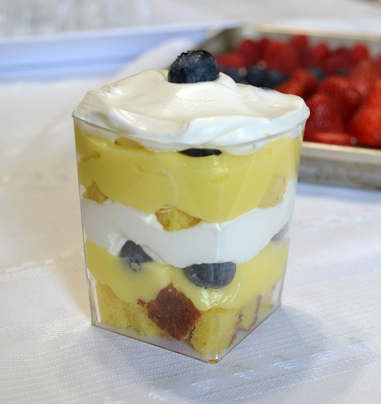 Punch bowl cake arranged in individual plastic cups. A variety of ingredients make them colorful and delicious.