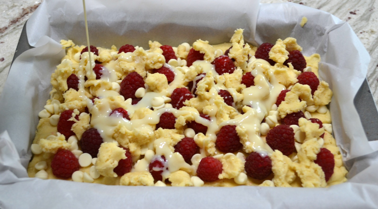 Raspberry White Chocolate Cake Bars are an easy to make, decadent dessert.