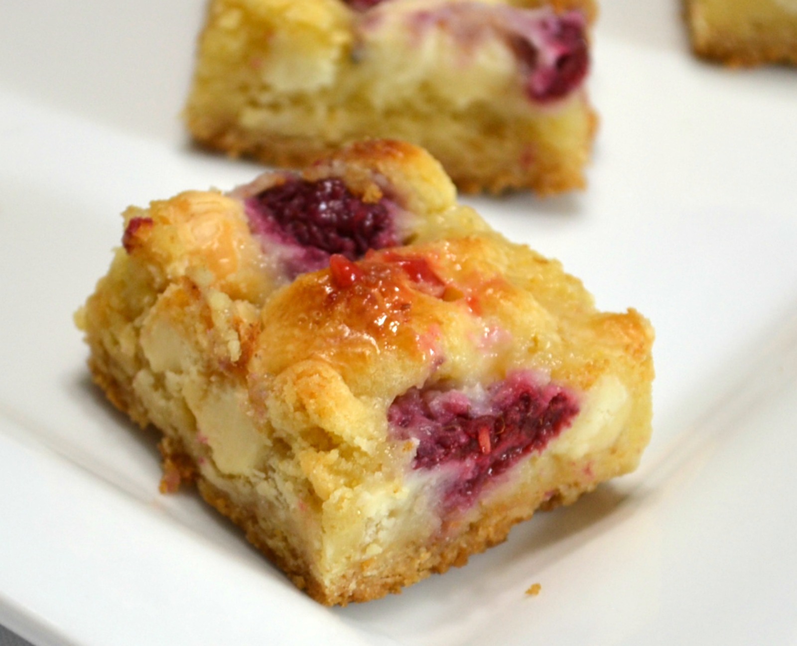 Raspberry White Chocolate Cake Bars are an easy to make, decadent dessert.