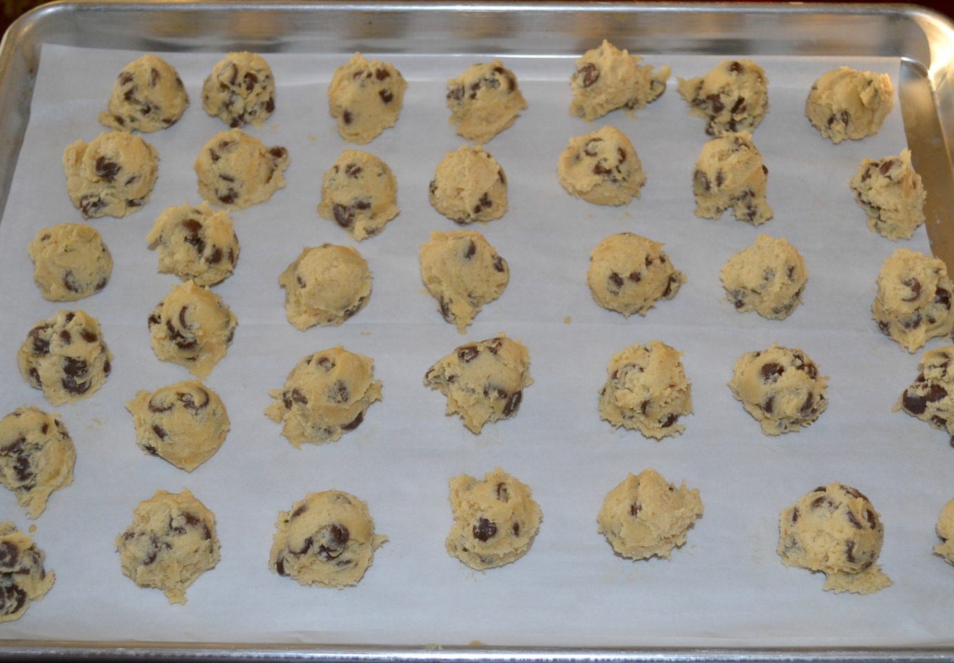 Preparing freezer cookie dough balls ahead of time allows you to bake fresh, homemade cookies in minutes with no mess