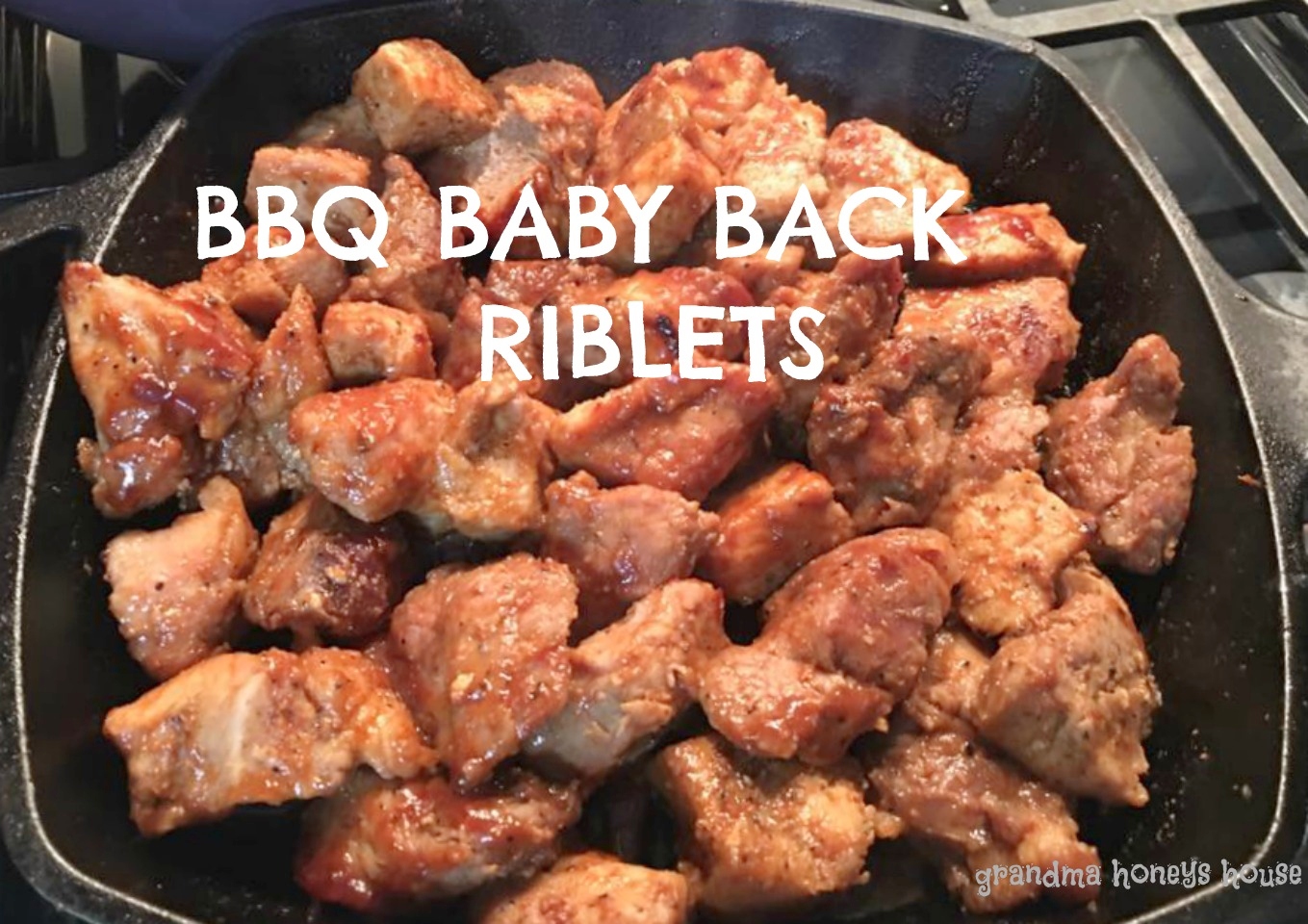 Moist, tender, BBQ Baby Back Riblets rubbed with a homemade rub, and simmered in homemade BBQ sauce.