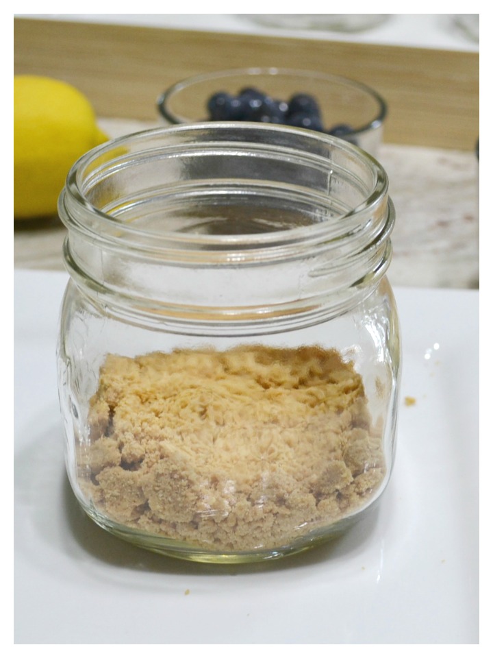 Meyer lemon whipped pudding, blueberries, and mascarpone cheese in a jar is the perfect summertime dessert.