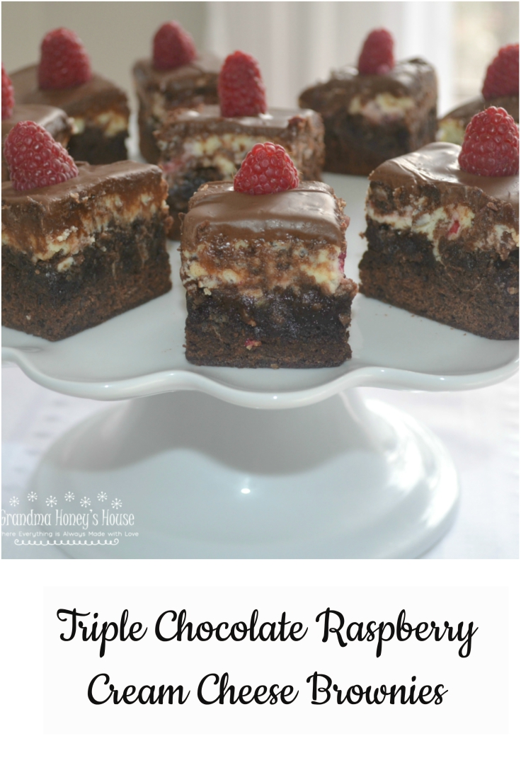 A rich, elegant brownies filled with chocolate chips, a cream cheese and raspberry filling, topped with melted chocolate.