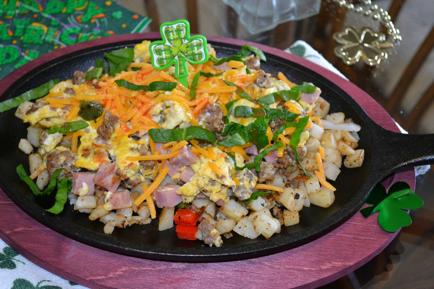 St. Patrick's Day breakfast skillets packed with eggs, meats, veggies, and cheese.