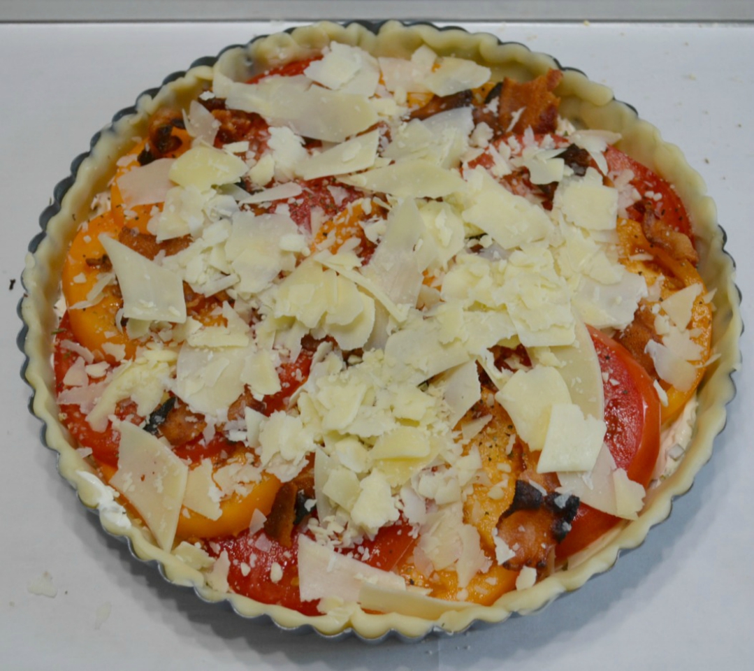 This Garden Fresh Tomato Bacon Tart is a crust filled with chive & onion cream cheese,fontina,fresh tomatoes,bacon and seasonings. Perfect for summertime eating