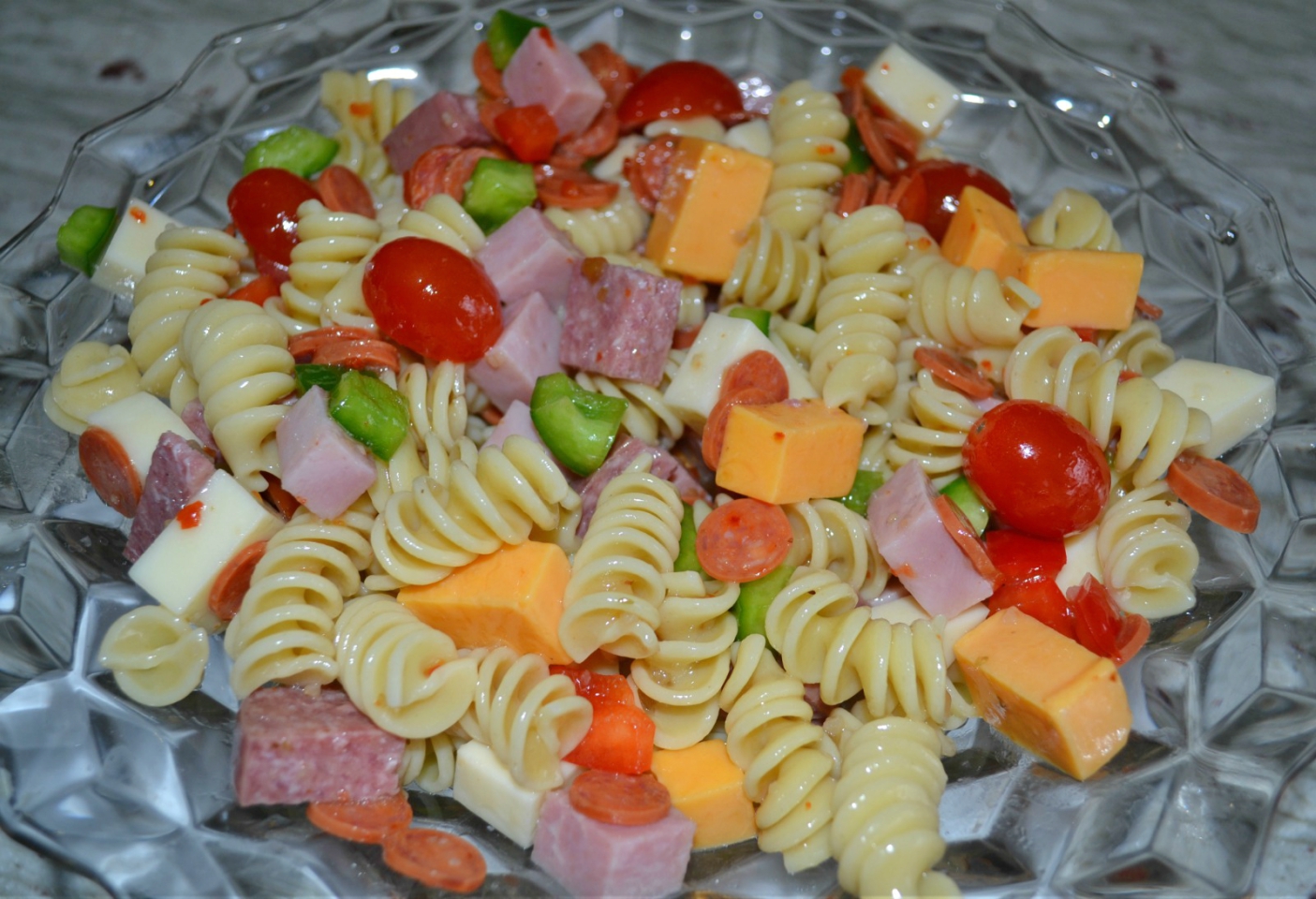 This Protein Packed Pasta Salad is loaded with veggies, meats, and cheeses. Colorful, delicious, and perfect to transport to any summer event.