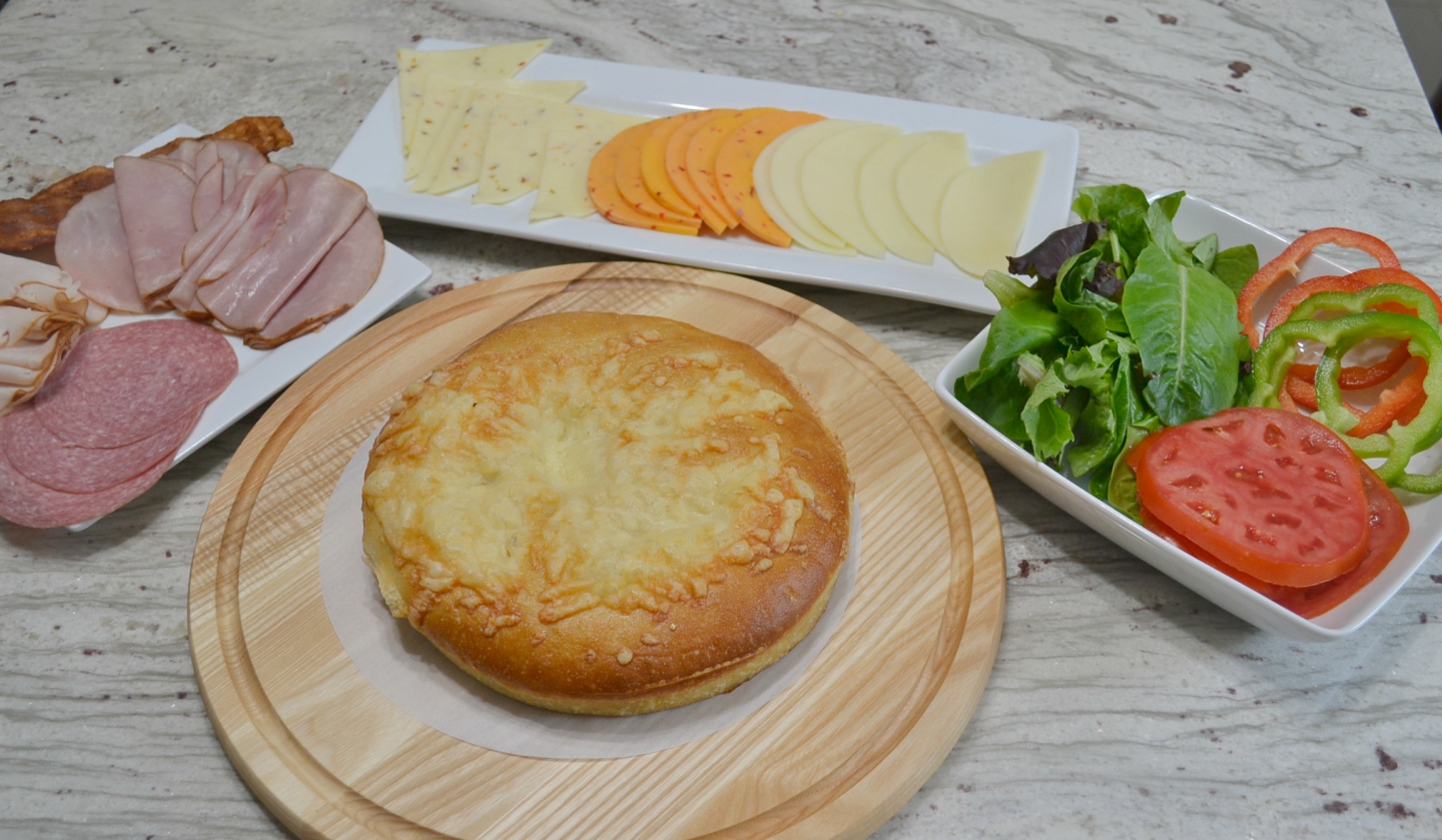 Picnic Foccacia Sandwich is loaded with meats, cheeses,and veggies. Made on a foccia loaf, drizzled with italian dressing and cut into beautiful wedges