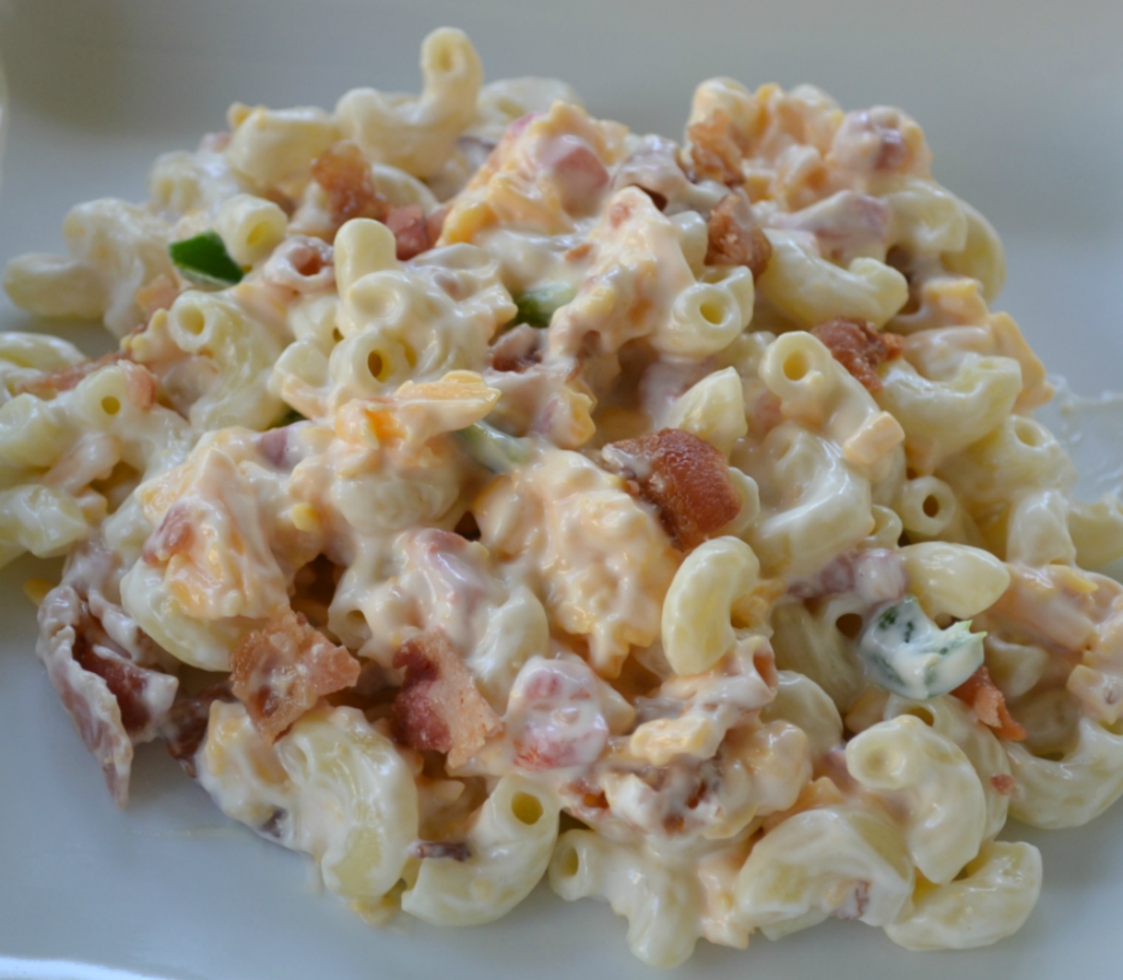 Pimento Bacon Macaroni Salad is the perfect southern style dish with a pimento cheese base, bacon, and a touch of heat from the jalapenos.