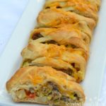 Sausage Apple Cheddar Brunch Braid is a breakfast filling wrapped up in a crescent dough and baked.