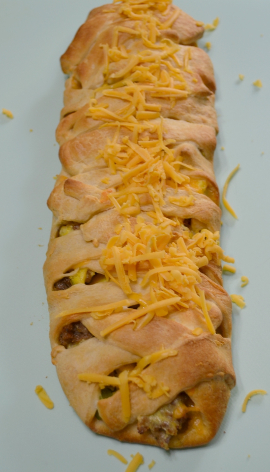 Sausage Apple Cheddar Brunch Braid is a breakfast filling wrapped up in a crescent dough and baked.