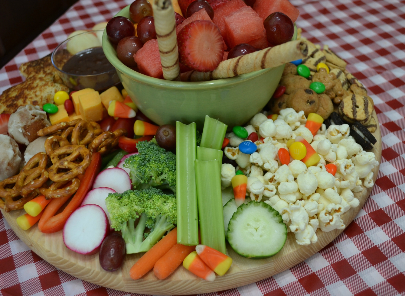 This After School Snack Board is a fun collection of treats for your kids. The board is packed with fruits, veggies, cheese, and sweet treats. 