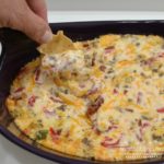 This Hot Pimento-Sausage Dip is perfect for any party. This dip has a pimento cheese base, with bacon, jalapenos, and sausage added. Perfect with chips, crackers,bread, or veggies.