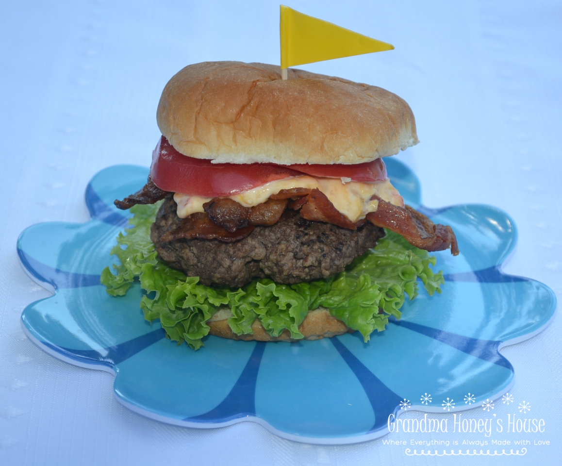 A delicious burger topped with a Spicy Pimento Cheese-Bacon Spread.