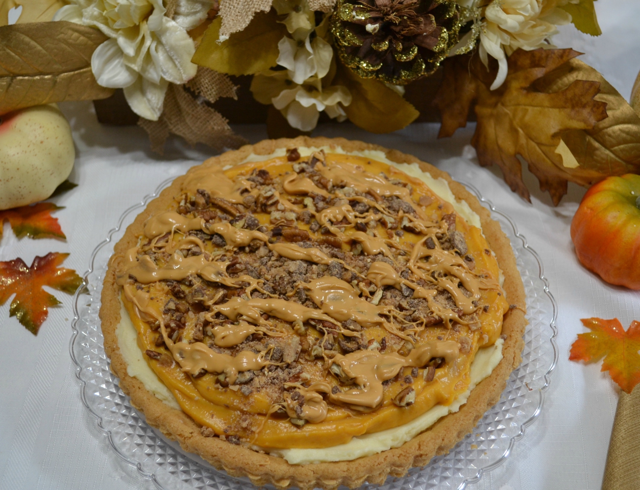 Pumpkin Butterscotch Mascarpone Cookie Tart is a perfect fall dessert with a cookie tart and layers of pumpkin, mascarpone cheese and toppings of toffee bits and butterscotch.