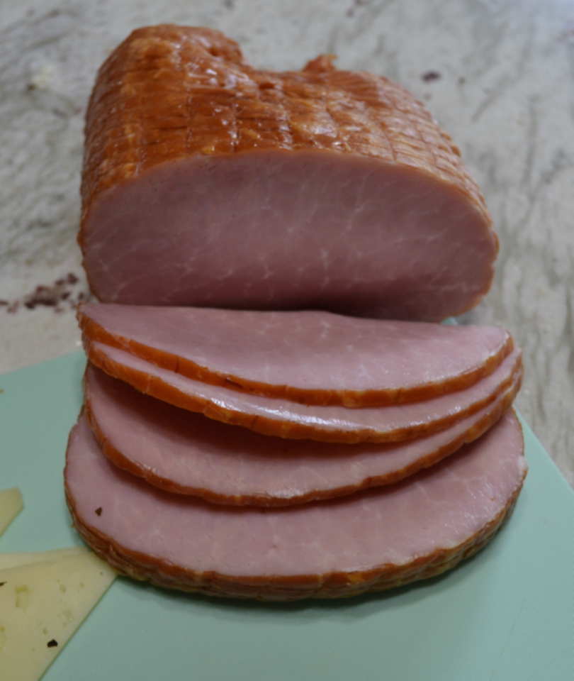 Gourmet Ham and Cheese Party Ring is perfect for any get together. A giant sandwich loaf filled with ham, cheeses, and veggies.