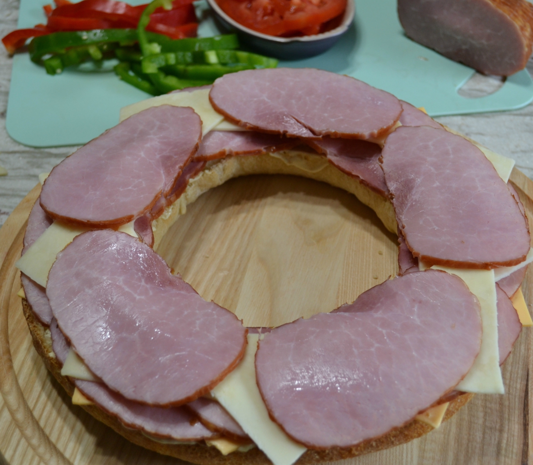 Gourmet Ham and Cheese Party Ring is perfect for any get together. A giant sandwich loaf filled with ham, cheeses, and veggies.