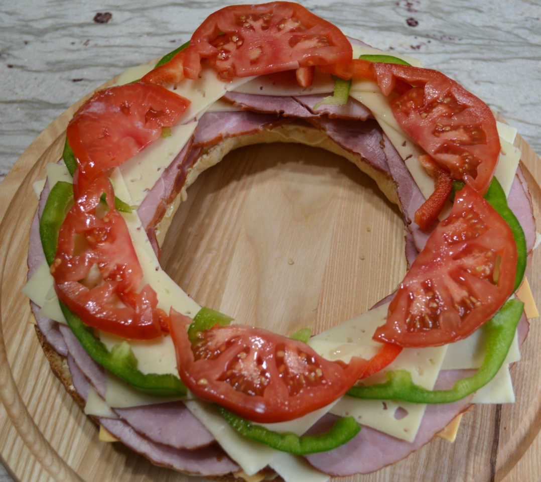 Gourmet Ham and Cheese Party Ring is perfect for any get together. A giant sandwich loaf filled with ham, cheeses, and veggies.