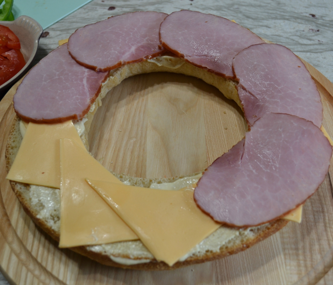 Gourmet Ham and Cheese Party Ring is perfect for any get together. A giant sandwich loaf filled with ham, cheeses, and veggies.