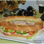 Gourmet Ham and Cheese Party Ring is perfect for any get together. A giant sandwich loaf filled with ham, cheeses, and veggies.