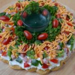 This Christmas Crescent Appetizer Wreath is a festive spin on a veggie pizza.