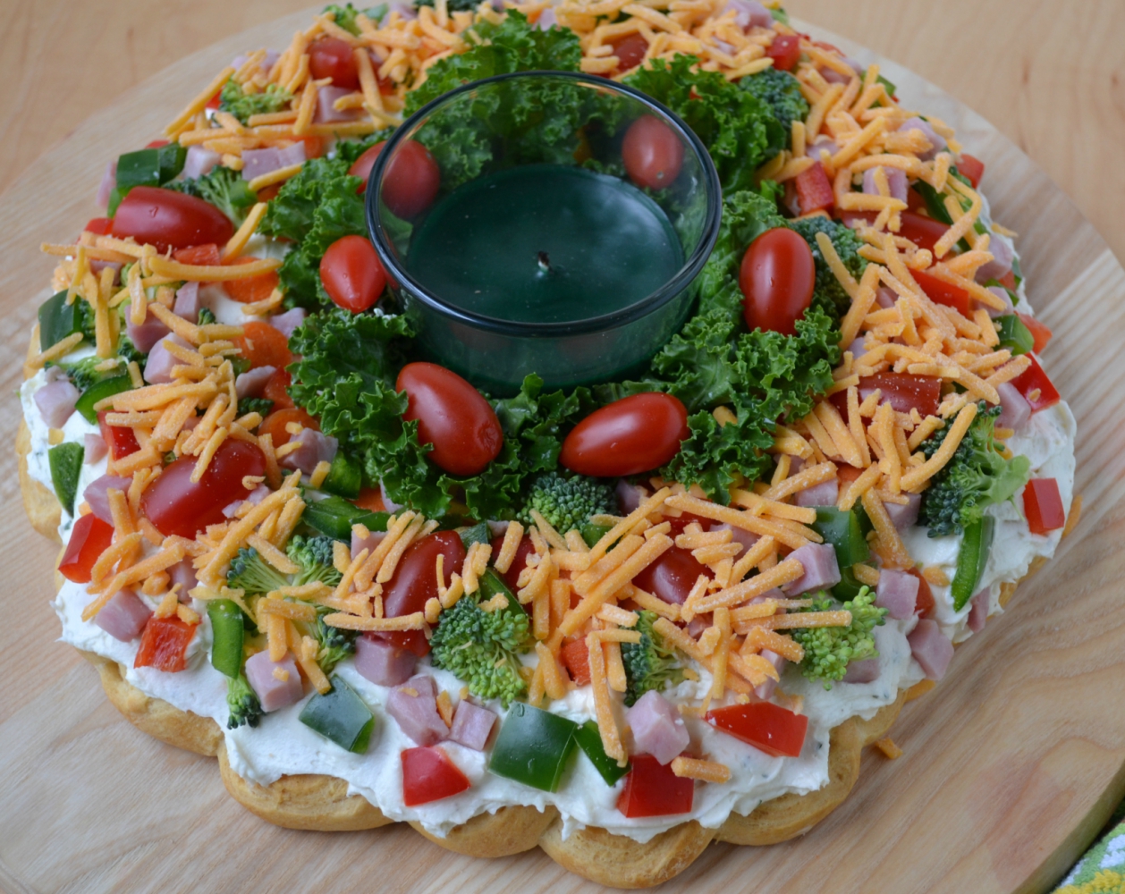 This Christmas Crescent Appetizer Wreath is a festive spin on a veggie pizza.