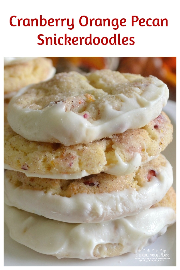 A basic snickerdoodle recipe gets a makeover with the addition of fresh cranberries, orange zest, orange juice and pecans. Cookies are then dipped in melted white chocolate.