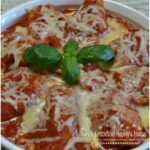 Pasta shells stuffed with a filling of spicy sausage, baby spinach, creamy ricotta and mozzarella cheese are topped with pasta sauce and more cheese. Baked to perfection and served with garlic bread for a quick dinner.