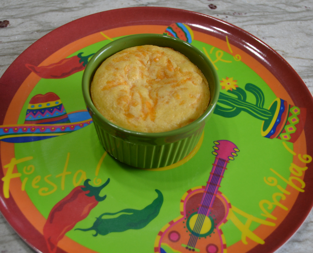 Cornbread Topped Taco Pot Pie is a ramekin filled with a taco meat filling, salsa, cheese, and then covered with a cornbread topping. 