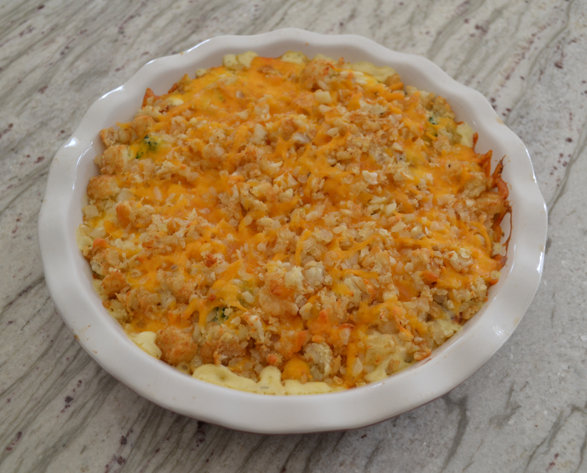A creamy chicken casserole with bacon, ranch, broccoli and then topped with shredded tater tots and cheddar cheese. It is baked until cheese is melted and mixture is bubbly.