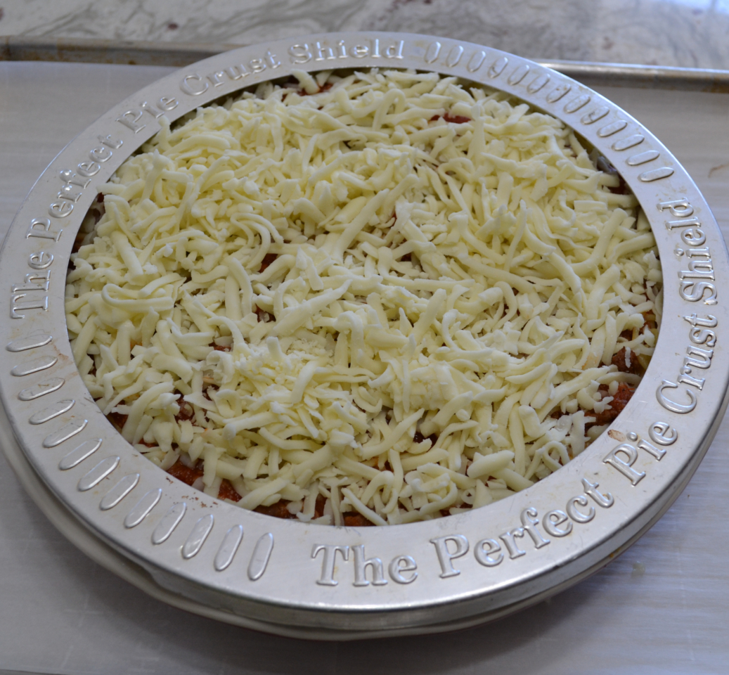 Cheesy Spaghetti Pie is baked in a deep dish pie plate with a crust of spaghetti,a layer of ricotta,then topped with homemade pasta sauce and mozzarella cheese.