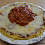 Cheesy Spaghetti Pie is baked in a deep dish pie plate with a crust of spaghetti,a layer of ricotta,then topped with homemade pasta sauce and mozzarella cheese.