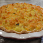 A loaded quiche with sausage, ham, peppers, spinach, cheese, eggs and half and half.  Top it off with a mixture of crumbled tater tots, cheddar cheese, and diced jalapenos for a  special brunch dish