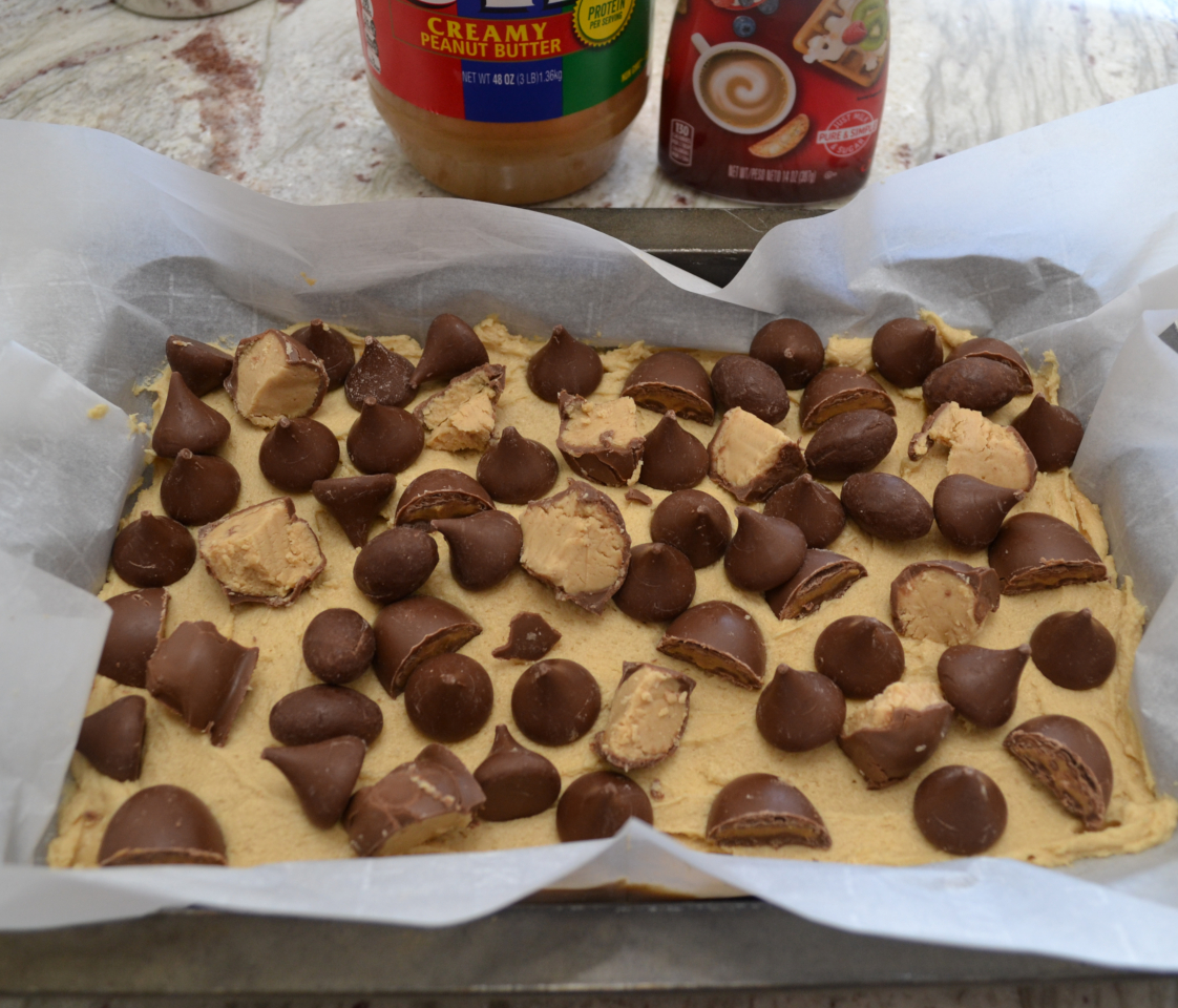 Peanut Butter Candy Bite Cookie Bars are a rich, gooey, treat loaded with peanut butter and bite size pieces of candy.